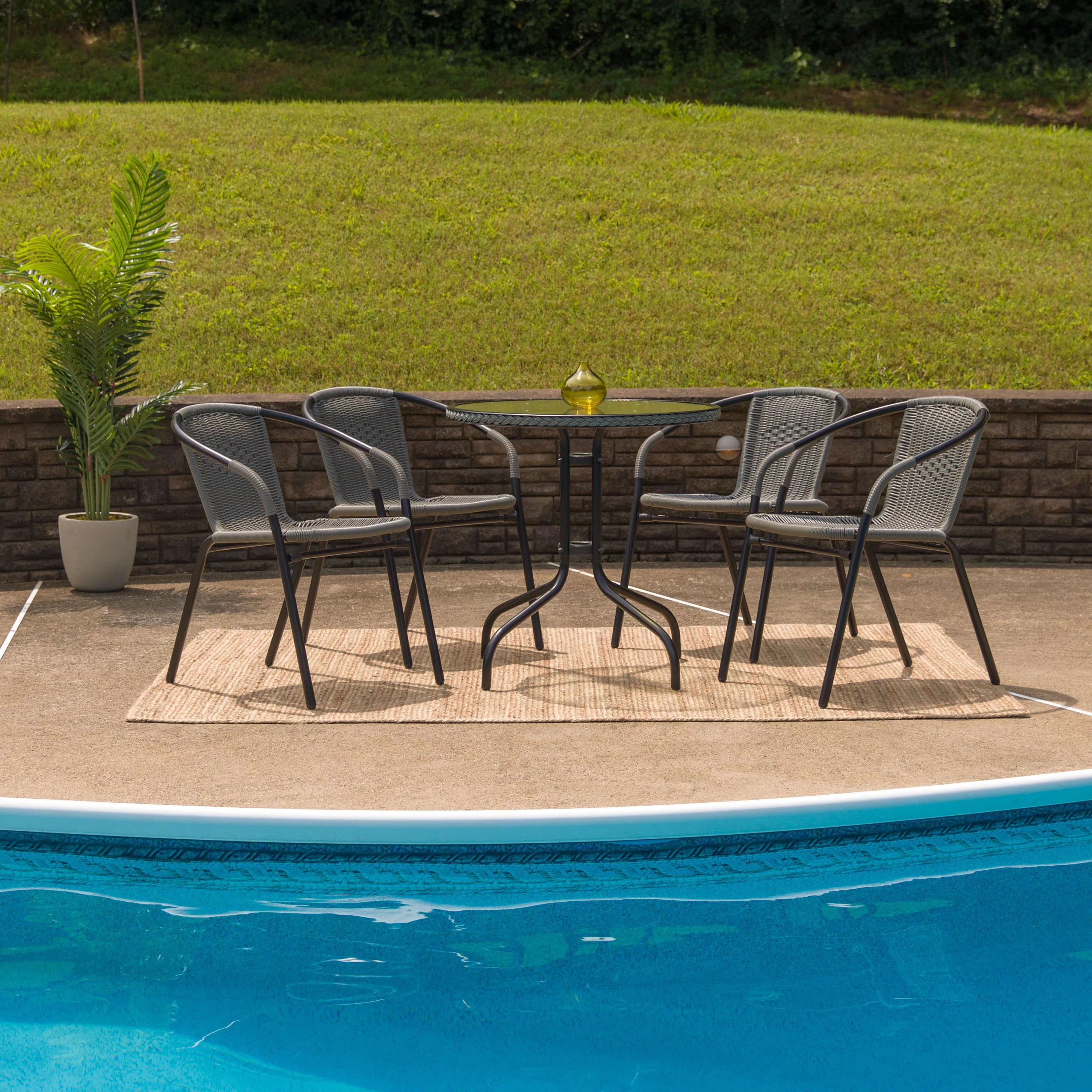 Barker 28'' Round Glass Metal Table with Rattan Edging and 4 Rattan Stack Chairs